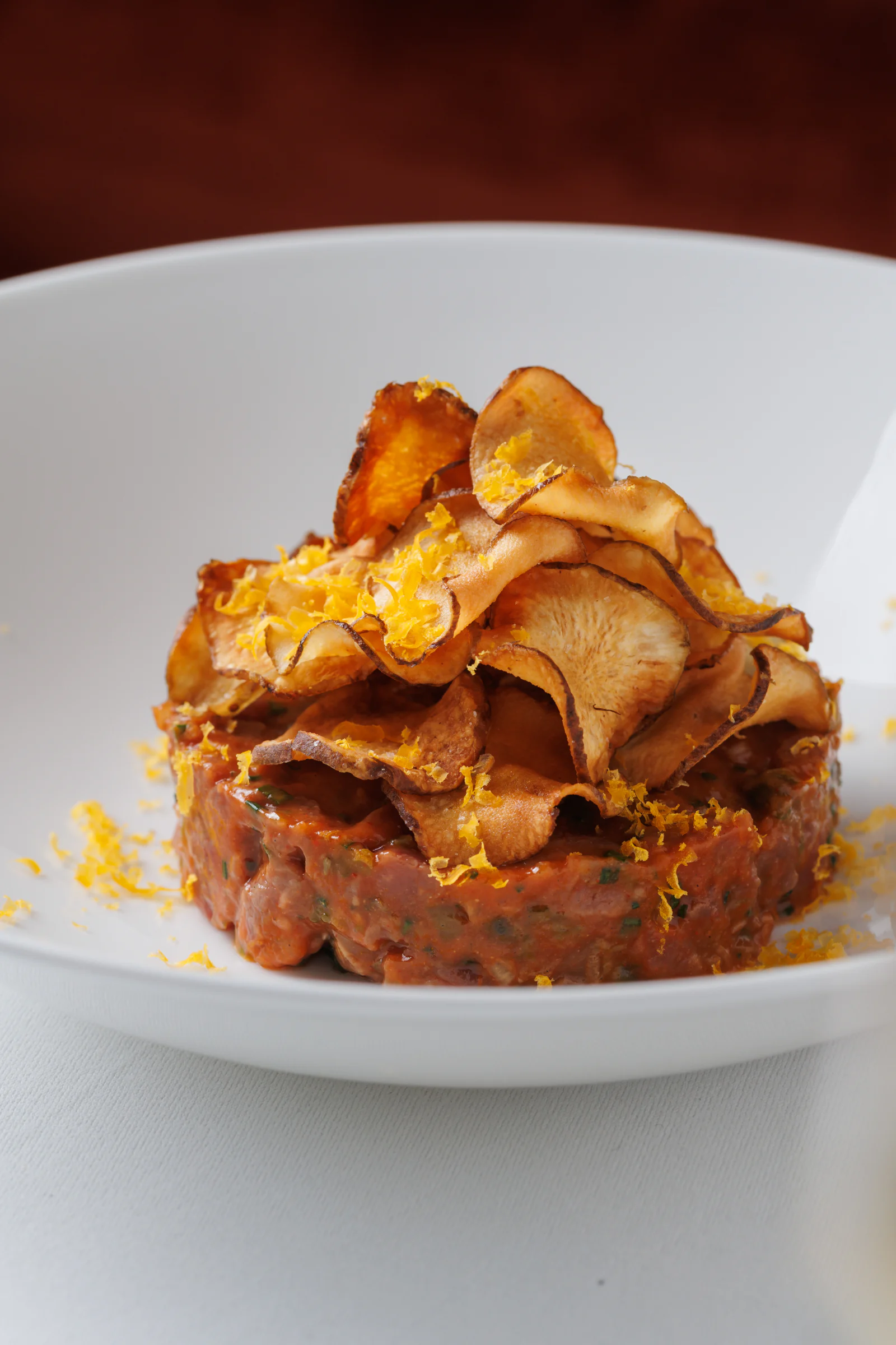 Tartare crowned with crisped root vegetables